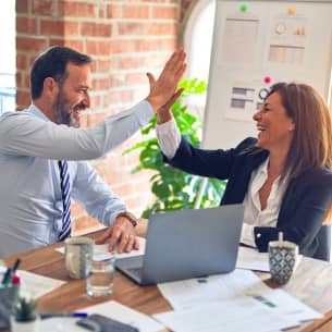 Tax professional and client high fiving