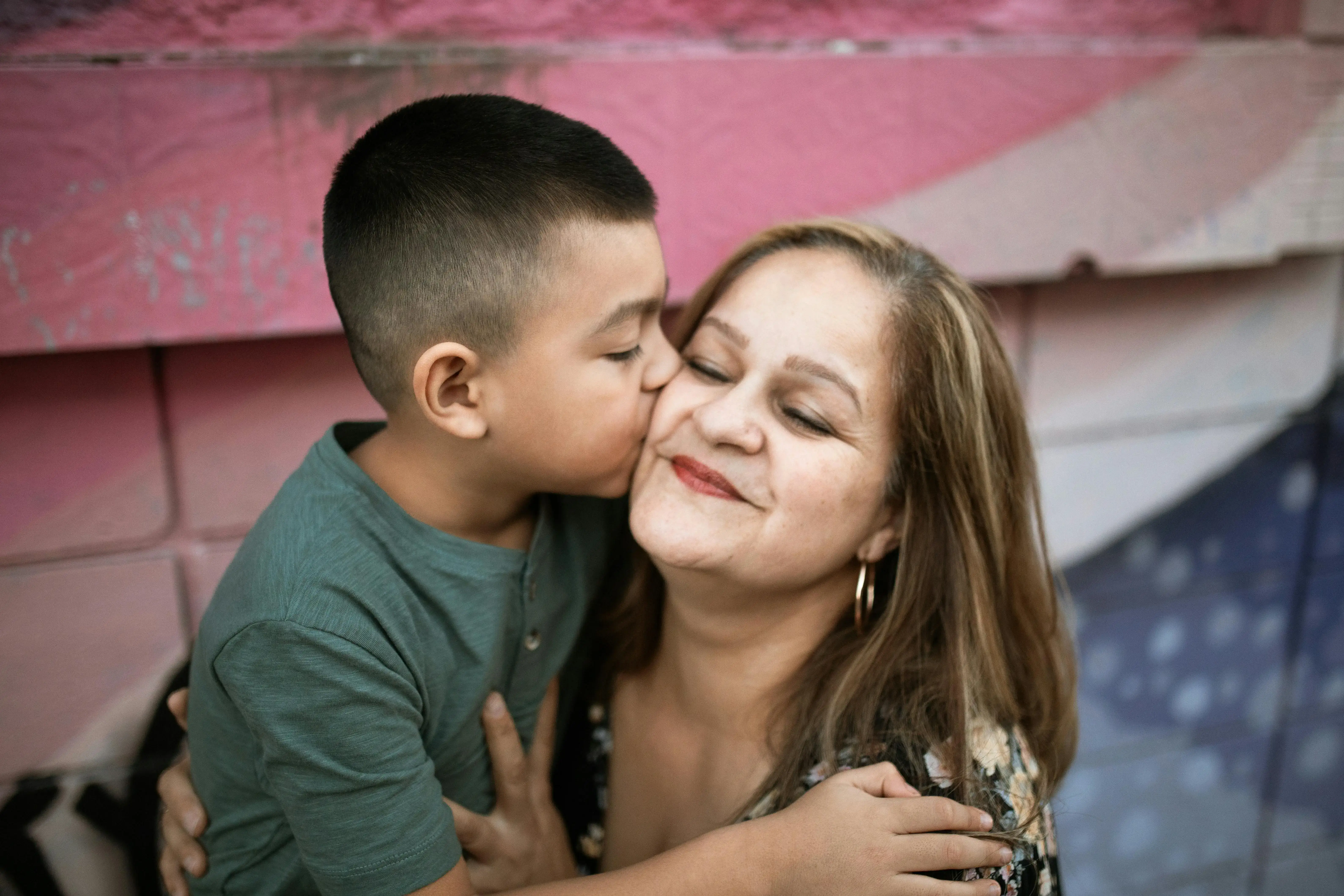 Mother and son hugging